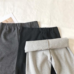 Leggings elásticos cálidos con bordes de piel sintética