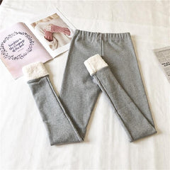 Leggings elásticos cálidos con bordes de piel sintética