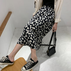 Falda larga holgada negra de cintura alta con estampado de flores