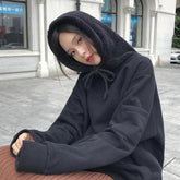 Sudadera extragrande de color liso con capucha de piel esponjosa