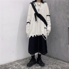 Suéter suelto de punto estilo grunge con flecos rotos