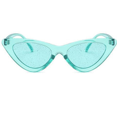Gafas de sol con montura de plástico estilo gato y lentes transparentes con purpurina