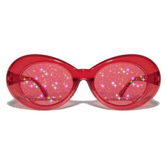 Gafas de sol ovaladas con montura de plástico brillante y lentes transparentes con purpurina