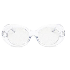 Gafas de sol ovaladas con montura de plástico brillante y lentes transparentes con purpurina