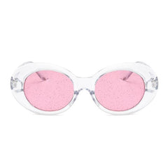 Gafas de sol ovaladas con montura de plástico brillante y lentes transparentes con purpurina