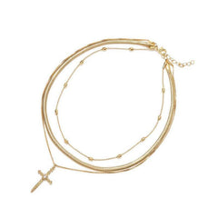 Collar cruzado con cadenas metálicas doradas