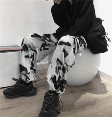 Pantalones extragrandes con estampado tie-dye grunge y bolsillos