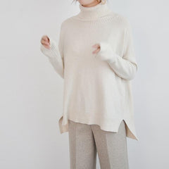 Suéter largo de punto acanalado con cuello alto