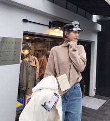 Suéter de punto con cuello alto de tortuga y colores caramelo