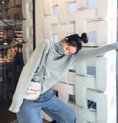 Suéter de punto con cuello alto de tortuga y colores caramelo