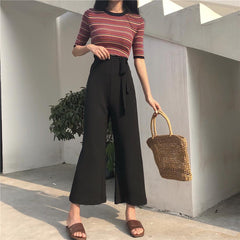 Pantalones largos acampanados de gasa negra y beige con cinturón extragrande