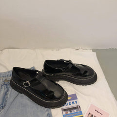 Sandalias de plataforma retro negras mate y brillantes