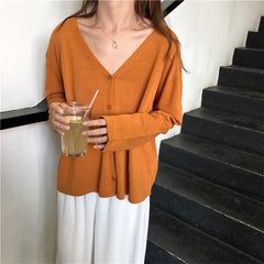 Camisa tipo cárdigan fino con cuello en V, color naranja, rosa y negro