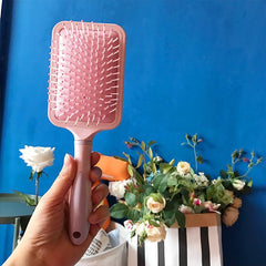 Cepillo de pelo de masaje de plástico rosa lila