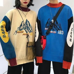 Suéter holgado con estampado de montaña retro beige y azul