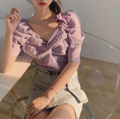 Blusa retro elegante de manga corta con nudo en el pecho