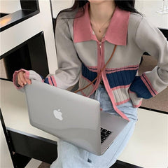 Suéter tipo cárdigan de punto con cremallera y canalé en tonos pastel retro