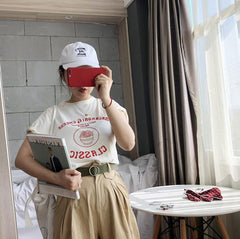 Cinturón básico acanalado con hebilla metálica redonda