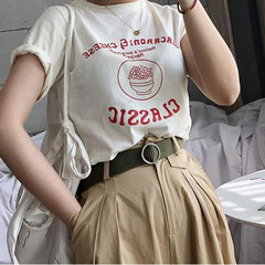 Cinturón básico acanalado con hebilla metálica redonda