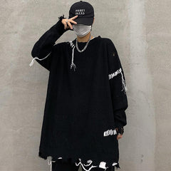 Suéter suelto de punto estilo grunge con flecos rotos en oferta
