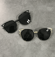 Gafas de sol con esquinas metálicas afiladas y tonos negros