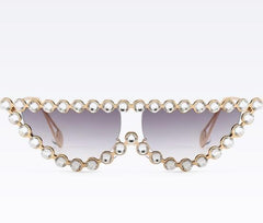 Gafas de sol con montura metálica brillante y elegante con diamantes