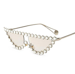 Gafas de sol con montura metálica brillante y elegante con diamantes