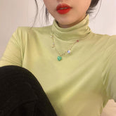 Gargantilla de cadena dorada con colgante de sonrisa y corazón