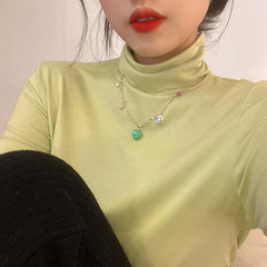 Gargantilla de cadena dorada con colgante de sonrisa y corazón