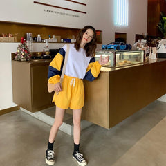 Conjunto deportivo de 2 piezas: sudadera con bloques de color y pantalones cortos holgados