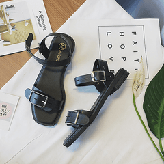 Sommerliche Sandalen mit offener Schnalle und minimalistischem Schwarz-Beige