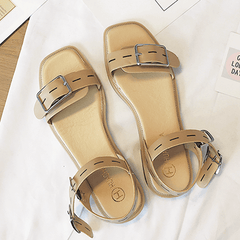 Sommerliche Sandalen mit offener Schnalle und minimalistischem Schwarz-Beige