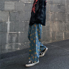 Pantalones vaqueros extragrandes de color azul azadón con estampado de girasoles