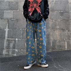 Pantalones vaqueros extragrandes de color azul azadón con estampado de girasoles