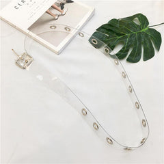 Transparenter ästhetischer Gummigürtel mit metallischen Löchern