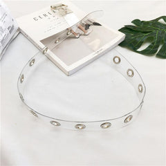 Transparenter ästhetischer Gummigürtel mit metallischen Löchern