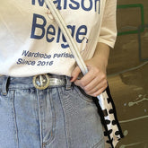 Cinturón de goma holográfica transparente con destellos dorados y plateados