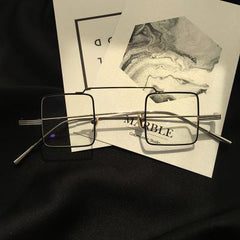 Gafas coreanas transparentes con montura metálica cuadrada urbana