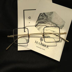 Gafas coreanas transparentes con montura metálica cuadrada urbana