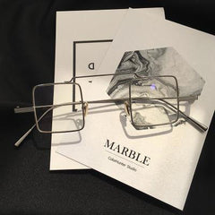 Gafas coreanas transparentes con montura metálica cuadrada urbana