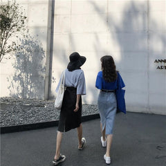 Falda midi vintage de mezclilla azul y negra con cintura alta y rasgada