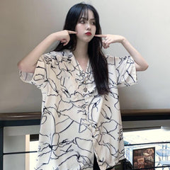 Weiße, lockere Freizeitbluse mit Risslinien-Print