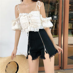 Pantalones cortos de mezclilla de cintura alta con cremalleras negras rasgadas