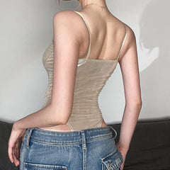 Body de cuero metalizado con tirantes finos y tiro alto