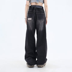 Vaqueros holgados desgastados con efecto tie-dye grunge