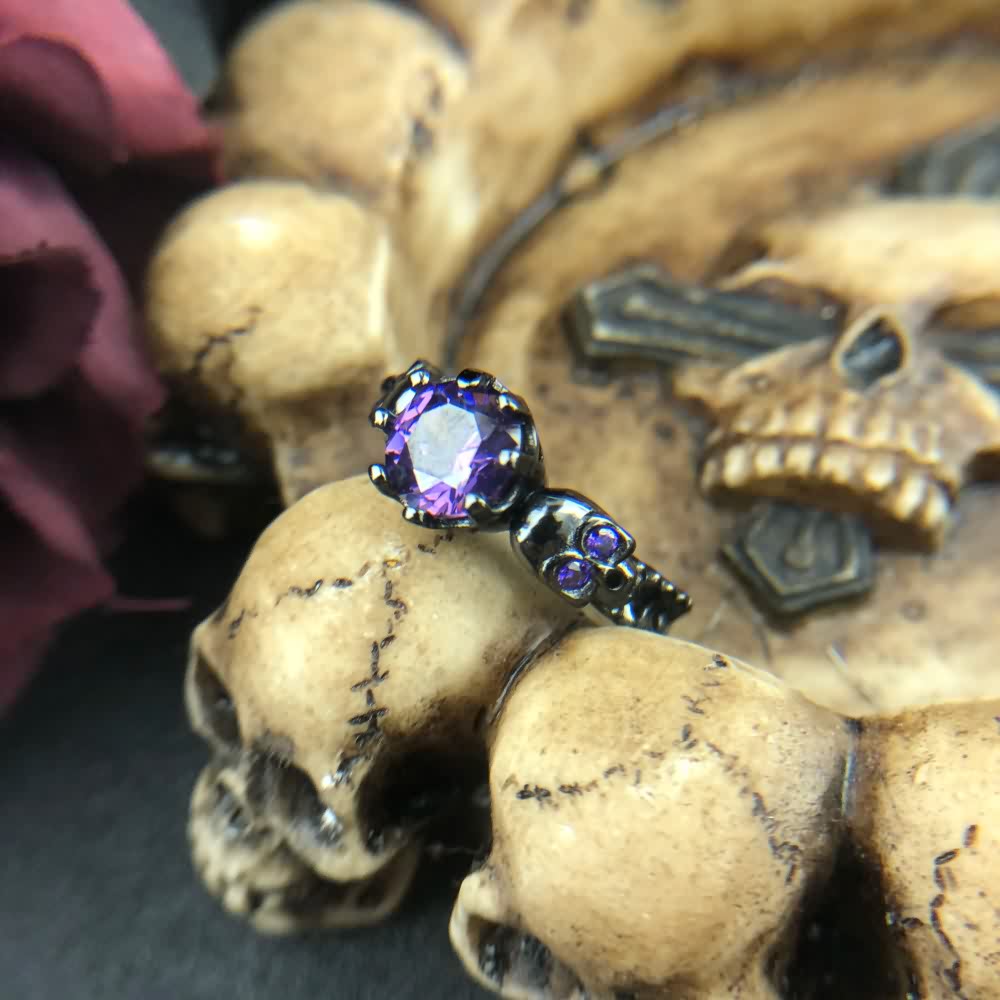 Gothic Purple Gemstone Ring with Sculpted Skulls