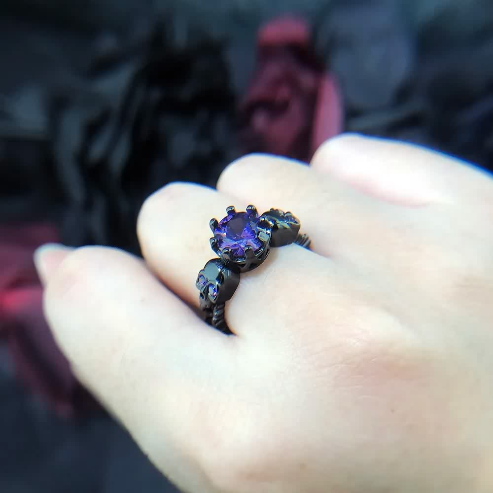 Gothic Purple Gemstone Ring with Sculpted Skulls