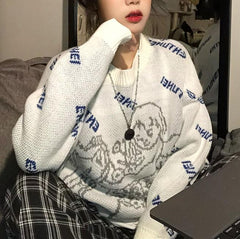 Weißer, lockerer Strickpullover mit Vintage-Engelsmuster 